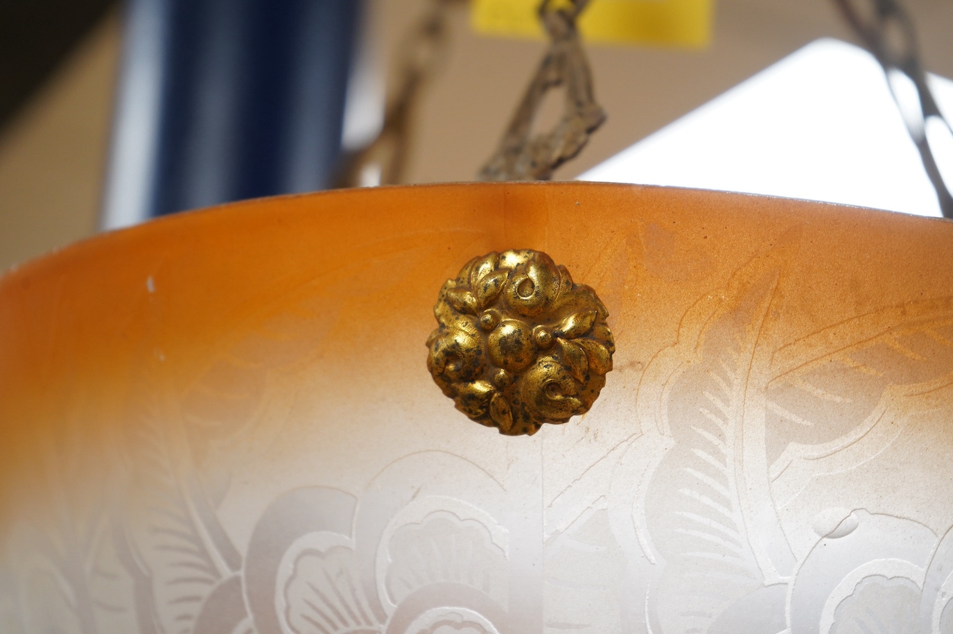 A French frosted glass acid etched with orange colour edge plaffonier ceiling light with original antique brass chain and ceiling rose, circa 1920’s-1930’s, wired, overall 47cm high, top of shade 35.5cm diameter, 13cm de